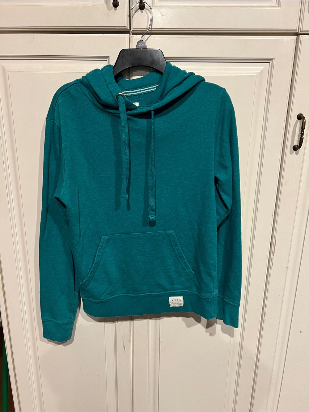 Woman’s AERO hoodie, super soft teal. Perfect for fall